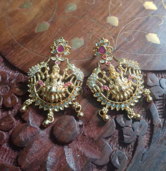 Lakshmi-themed earring with premium gold finish and CZ stones.