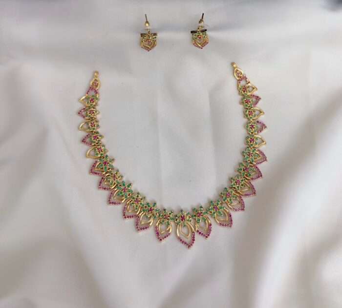 Radiant gold CZ opulence set with shimmering stones and rich design.
